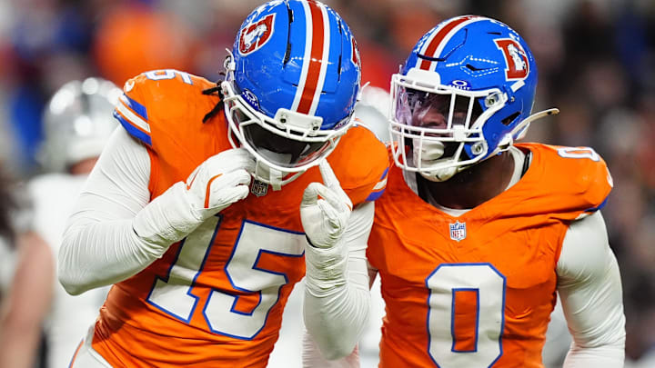 Nov 6, 2025; Denver, Colorado, USA; Denver Broncos linebacker Nik Bonitto (15) and linebacker Jonathon Cooper (0) react during the first half at Empower Field at Mile High. Mandatory Credit: Ron Chenoy-Imagn Images Nov 6, 2025; Denver, Colorado, USA; Denver Broncos linebacker Nik Bonitto (15) and linebacker Jonathon Cooper (0) react during the first half at Empower Field at Mile High. Mandatory Credit: Ron Chenoy-Imagn Images