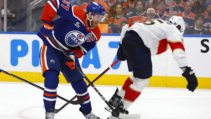 Edmonton Oilers center Connor McDavid skates past Florida Panthers defenseman Aaron Ekblad
