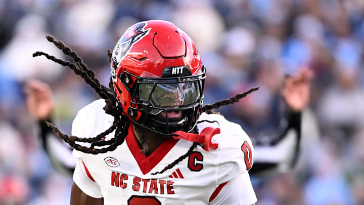 Nov 30, 2024; Chapel Hill, North Carolina, USA; North Carolina State Wolfpack linebacker Sean Brown (0) reacts after recovering a fumble in the first quarter at Kenan Memorial Stadium. Mandatory Credit: Bob Donnan-Imagn Images Nov 30, 2024; Chapel Hill, North Carolina, USA; North Carolina State Wolfpack linebacker Sean Brown (0) reacts after recovering a fumble in the first quarter at Kenan Memorial Stadium. Mandatory Credit: Bob Donnan-Imagn Images