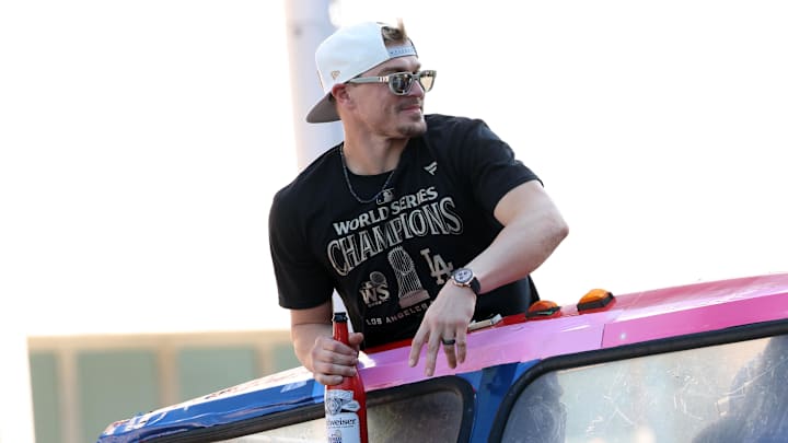 Nov 1, 2024; Los Angeles, CA, USA;  Los Angeles Dodgers outfielder Enrique Hernandez celebrates with fans during the 2024 World Series Championship parade in downtown LA.