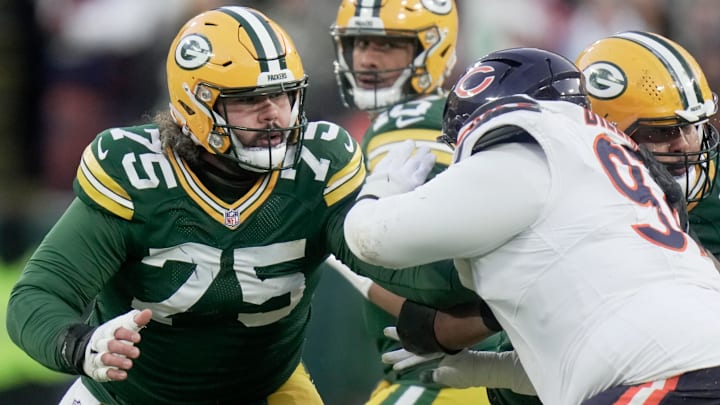 Dec 7, 2025; Green Bay, Wisconsin, USA; Green Bay Packers' Sean Rhyan (75) blocks Chicago Bears defensive tackle Andrew Billings (97) while providing pass protection during the first quarter at Lambeau Field.