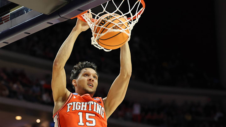 Mar 16, 2023; Des Moines, IA, USA; Illinois Fighting Illini guard RJ Melendez (15) dunks against the Arkansas Razorbacks during the first half at Wells Fargo Arena. Mandatory Credit: Reese Strickland-Imagn Images