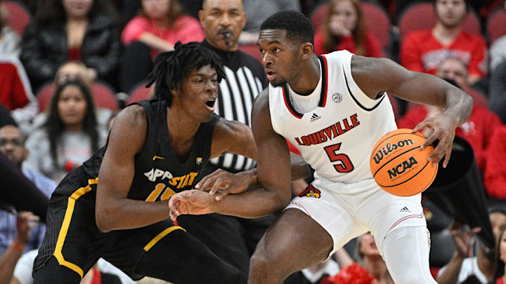 Nov 15, 2022; Louisville, Kentucky, USA; Louisville Cardinals forward Brandon Huntley-Hatfield (5) dribbles against Appalachian State Mountaineers forward CJ Huntley (15) during the first half at KFC Yum! Center. Appalachian State defeated Louisville 61-60. Mandatory Credit: Jamie Rhodes-Imagn Images Nov 15, 2022; Louisville, Kentucky, USA; Louisville Cardinals forward Brandon Huntley-Hatfield (5) dribbles against Appalachian State Mountaineers forward CJ Huntley (15) during the first half at KFC Yum! Center. Appalachian State defeated Louisville 61-60. Mandatory Credit: Jamie Rhodes-Imagn Images