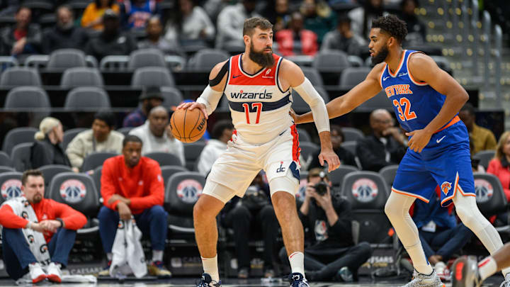 Oct 18, 2024; Washington, District of Columbia, USA; Washington Wizards center Jonas Valanciunas (17) dribbles the ball while being defended by New York Knicks center Karl-Anthony Towns (32) during the first quarter at Capital One Arena. Mandatory Credit: Reggie Hildred-Imagn Images