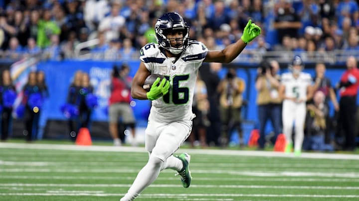 Sep 30, 2024; Detroit, Michigan, USA; Seattle Seahawks wide receiver Tyler Lockett (16) runs the ball against the Detroit Lions in the third quarter at Ford Field. Mandatory Credit: Eamon Horwedel-Imagn Images