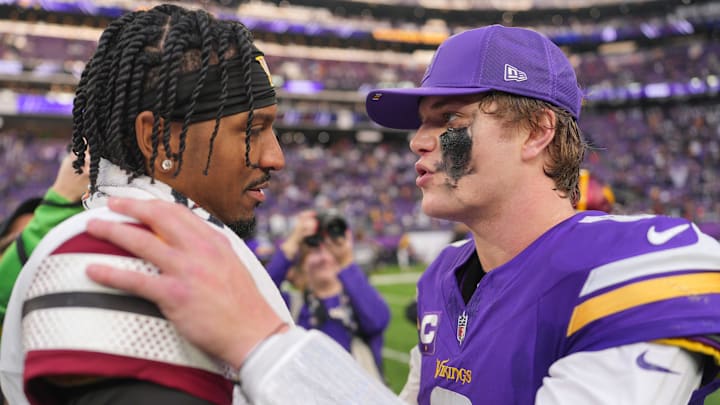 Minnesota Vikings quarterback J.J. McCarthy (9) reacts with Washington Commanders quarterback Jayden Daniels (5) after the game at U.S. Bank Stadium. Mandatory Credit: Brad Rempel-Imagn Images