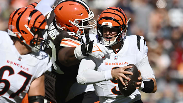 Oct 20, 2024; Cleveland, Ohio, USA; Cleveland Browns defensive tackle Shelby Harris (93) sacks Cincinnati Bengals quarterback Joe Burrow (9) during the first quarter at Huntington Bank Field. Mandatory Credit: Ken Blaze-Imagn Images