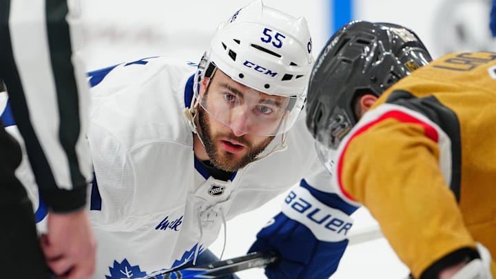 Jan 15, 2026; Las Vegas, Nevada, USA; Toronto Maple Leafs center Nicolas Roy (55) prepares for a face off against Vegas Golden Knights center Tanner Laczynski (28) during the first period at T-Mobile Arena. Mandatory Credit: Stephen R. Sylvanie-Imagn Images