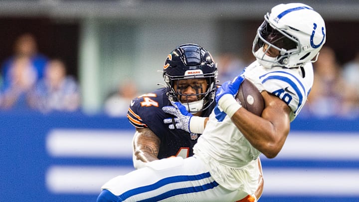 Aug 19, 2023; Indianapolis, Indiana, USA; Indianapolis Colts tight end Pharaoh Brown (49) is tackled by Chicago Bears linebacker Noah Sewell (44) in the first quarter at Lucas Oil Stadium. Mandatory Credit: Trevor Ruszkowski-Imagn Images
