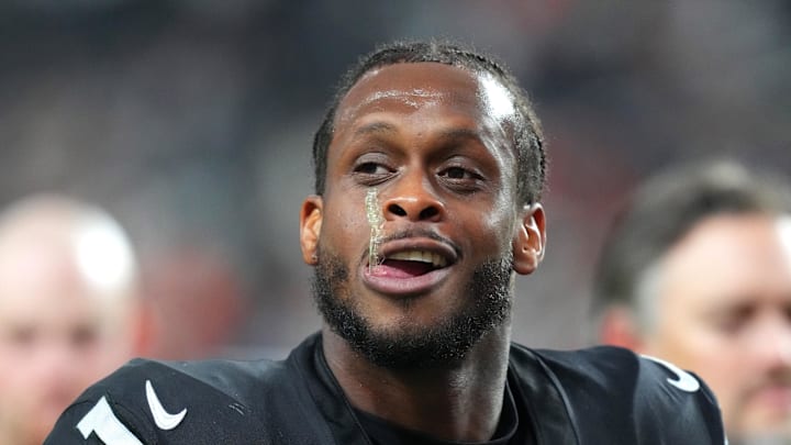 (EDITORS NOTE: obscene gesture in photo) Nov 23, 2025; Paradise, Nevada, USA; Vegas Raiders quarterback Geno Smith (7) gestures towards a fan after the Cleveland Browns defeated the Raiders 24-10 at Allegiant Stadium. Mandatory Credit: Stephen R. Sylvanie-Imagn Images 