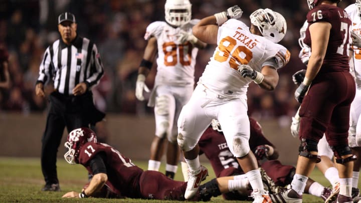 Nov 24, 2011; College Station, TX, USA; Texas Longhorns defensive lineman Desmond Jackson (99) celebrates sacking Texas A&M Aggies quarterback Ryan Tannehill (17) during the second half at Kyle Field. Texas won 27-25. Mandatory Credit: Thomas Campbell-US Presswire Nov 24, 2011; College Station, TX, USA; Texas Longhorns defensive lineman Desmond Jackson (99) celebrates sacking Texas A&M Aggies quarterback Ryan Tannehill (17) during the second half at Kyle Field. Texas won 27-25. Mandatory Credit: Thomas Campbell-US Presswire