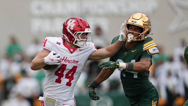 Nov 29, 2025; Waco, Texas, USA; Houston Cougars running back Dean Connors (44) carries the ball against Baylor Bears safety Micah Gifford (24) during the second half at McLane Stadium. Mandatory Credit: Chris Jones-Imagn Images Nov 29, 2025; Waco, Texas, USA; Houston Cougars running back Dean Connors (44) carries the ball against Baylor Bears safety Micah Gifford (24) during the second half at McLane Stadium. Mandatory Credit: Chris Jones-Imagn Images