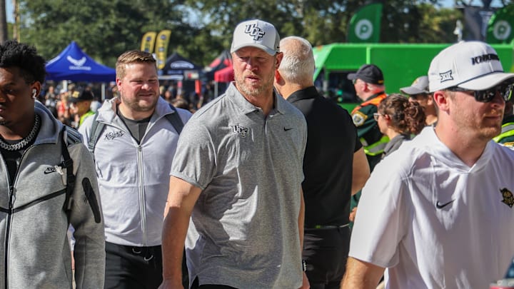 Nov 22, 2025; Orlando, Florida, USA; UCF Knights head coach Scott Frost walks into the venue before the game against the Oklahoma State Cowboys at Acrisure Bounce House. Mandatory Credit: Mike Watters-Imagn Images