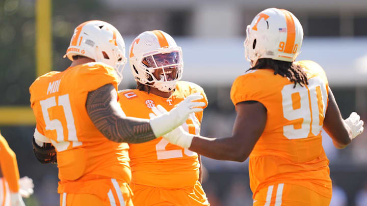 Tennessee defensive lineman Jaxson Moi (51), Tennessee defensive lineman Bryson Eason (20), and Tennessee defensive lineman Dominic Bailey (90) celebrate on the field during a college football game between Tennessee and Mississippi State at Davis Wade Stadium in Starkville, Miss., on Sept. 27, 2025.