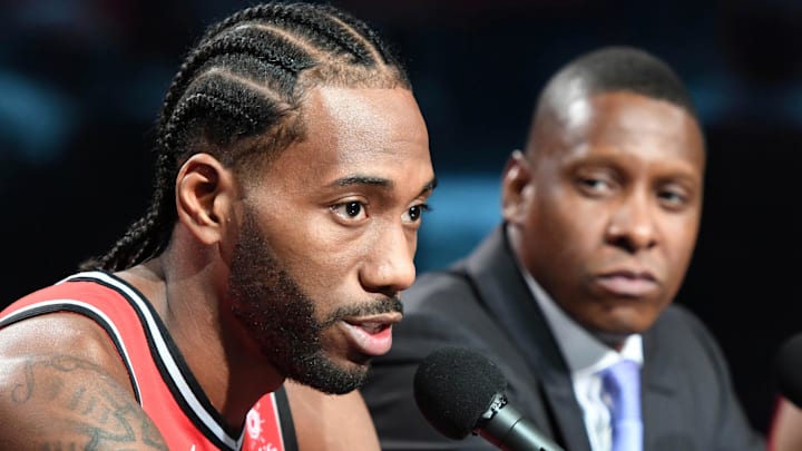 Sep 24, 2018; Toronto, Ontario, Canada; Toronto Raptors forward Kawhi Leonard (2) answers questions as club president Masai Ujiri listens during media day at Scotiabank Arena. Mandatory Credit: Dan Hamilton-Imagn Images Sep 24, 2018; Toronto, Ontario, Canada; Toronto Raptors forward Kawhi Leonard (2) answers questions as club president Masai Ujiri listens during media day at Scotiabank Arena. Mandatory Credit: Dan Hamilton-Imagn Images