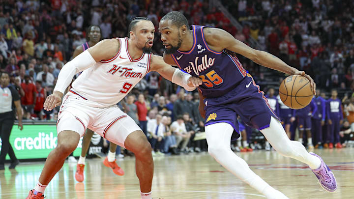 Feb 23, 2024; Houston, Texas, USA; Phoenix Suns forward Kevin Durant (35) drives to the basket as Houston Rockets forward Dillon Brooks (9) defends during the fourth quarter at Toyota Center. Mandatory Credit: Troy Taormina-Imagn Images