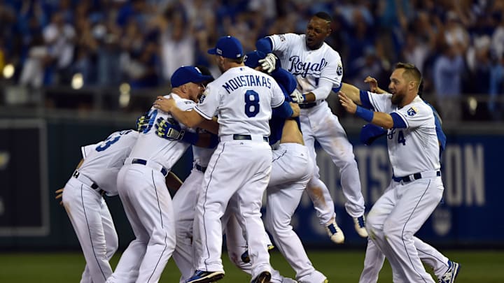 Sep 30, 2014; Kansas City, MO, USA; The Kansas City Royals celebrate after catcher Salvador Perez (13) hit a walk-off single against the Oakland Athletics during the twelfth inning of the 2014 American League Wild Card playoff baseball game at Kauffman Stadium. The Royals won 9-8. Mandatory Credit: Peter G. Aiken-Imagn Images
