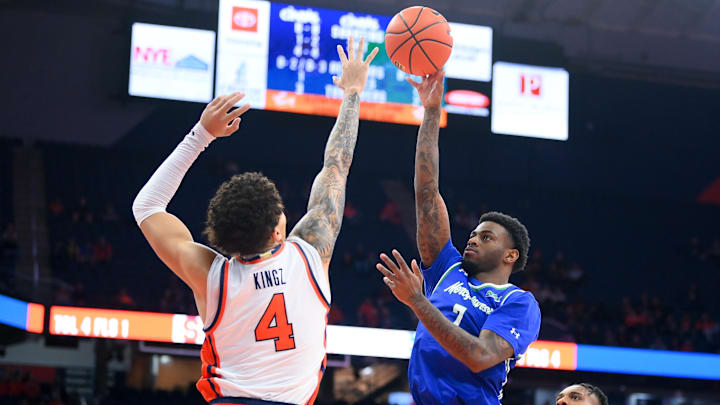 Dec 17, 2025; Syracuse, New York, USA; Mercyhurst Lakers guard Deshaun Jackson Jr. (7) shoots against Syracuse Orange guard Nate Kingz (4) during the first half at the JMA Wireless Dome. Mandatory Credit: Rich Barnes-Imagn Images