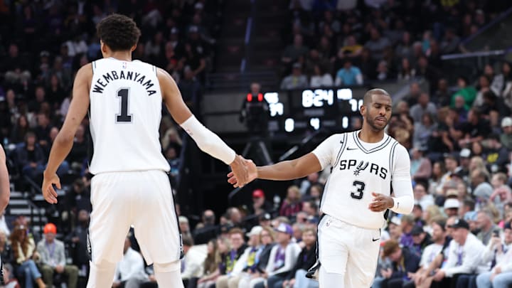 Oct 31, 2024; Salt Lake City, Utah, USA; San Antonio Spurs center Victor Wembanyama (1) and guard Chris Paul (3) react after a play against the Utah Jazz during the fourth quarter at Delta Center. Mandatory Credit: Rob Gray-Imagn Images