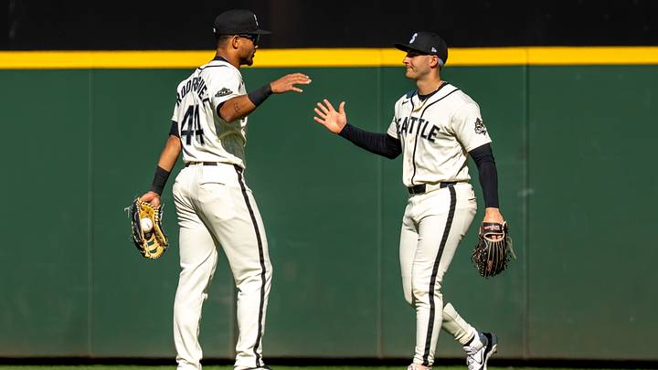 Sep 27, 2026; Seattle, Washington, USA; Seattle Mariners centerfielder Julio Rodriguez (44) and right fielder Dominic Canzone (8) celebrate after a game against the Los Angeles Angels at T-Mobile Park. Mandatory Credit: Stephen Brashear-Imagn Images Sep 27, 2026; Seattle, Washington, USA; Seattle Mariners centerfielder Julio Rodriguez (44) and right fielder Dominic Canzone (8) celebrate after a game against the Los Angeles Angels at T-Mobile Park. Mandatory Credit: Stephen Brashear-Imagn Images
