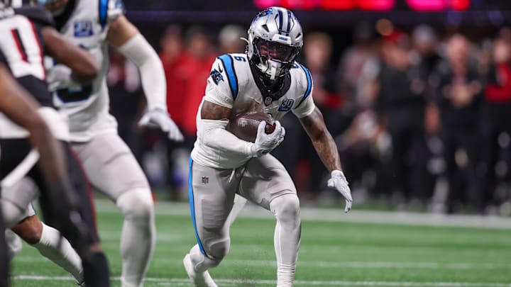 Jan 5, 2025; Atlanta, Georgia, USA; Carolina Panthers running back Miles Sanders (6) runs the ball against the Atlanta Falcons in the third quarter at Mercedes-Benz Stadium. Mandatory Credit: Brett Davis-Imagn Images