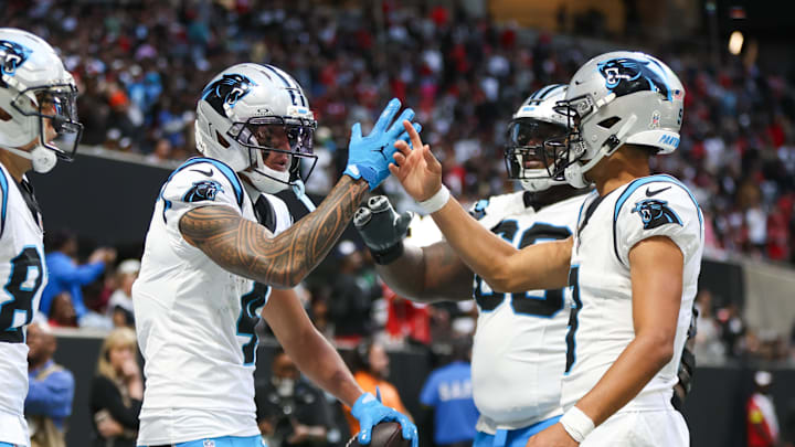 Carolina Panthers quarterback Bryce Young (9) shakes hands with wide receiver Tetairoa McMillan 