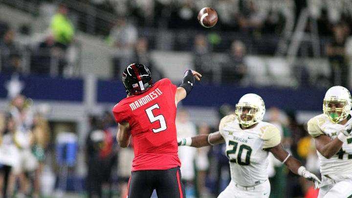 Nov 25, 2016; Arlington, TX, USA;  Texas Tech Red Raiders quarterback Patrick Mahomes (5) passes over Baylor Bears defensive back Aiavion Edwards (20) in the first half at AT&T Stadium. Mandatory Credit: Michael C. Johnson-Imagn Images