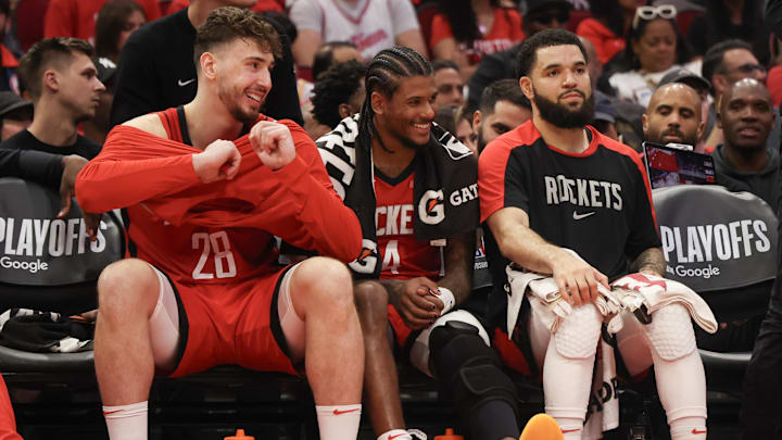 Apr 30, 2025; Houston, Texas, USA; From left to right, Houston Rockets center Alperen Sengun (28) guard Jalen Green (4) and guard Fred VanVleet (5) smile from the bench as their teammates play against the Golden State Warriors in the third quarter during game five of first round for the 2025 NBA Playoffs at Toyota Center. Mandatory Credit: Thomas Shea-Imagn Images