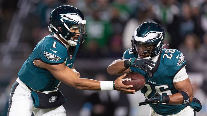 Nov 14, 2024; Philadelphia, Pennsylvania, USA; Philadelphia Eagles quarterback Jalen Hurts (1) hands off to running back Saquon Barkley (26) during the first quarter against the Washington Commanders at Lincoln Financial Field. Mandatory Credit: Bill Streicher-Imagn Images Nov 14, 2024; Philadelphia, Pennsylvania, USA; Philadelphia Eagles quarterback Jalen Hurts (1) hands off to running back Saquon Barkley (26) during the first quarter against the Washington Commanders at Lincoln Financial Field. Mandatory Credit: Bill Streicher-Imagn Images