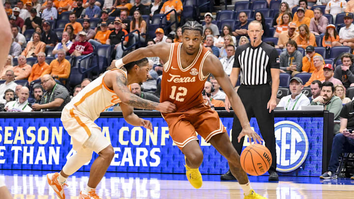 Mar 14, 2025; Nashville, TN, USA; Texas Longhorns guard Tramon Mark (12) drives to the basket past Tennessee Volunteers guard Chaz Lanier (2) during the second half at Bridgestone Arena. Mandatory Credit: Steve Roberts-Imagn Images Mar 14, 2025; Nashville, TN, USA; Texas Longhorns guard Tramon Mark (12) drives to the basket past Tennessee Volunteers guard Chaz Lanier (2) during the second half at Bridgestone Arena. Mandatory Credit: Steve Roberts-Imagn Images