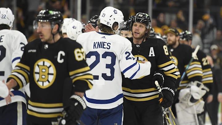 May 4, 2024; Boston, Massachusetts, USA; Toronto Maple Leafs left wing Matthew Knies (23) and Boston Bruins right wing David Pastrnak (88) speak after the Bruins defeated the Leafs in overtime in game seven of the first round of the 2024 Stanley Cup Playoffs at TD Garden. Mandatory Credit: Bob DeChiara-Imagn Images