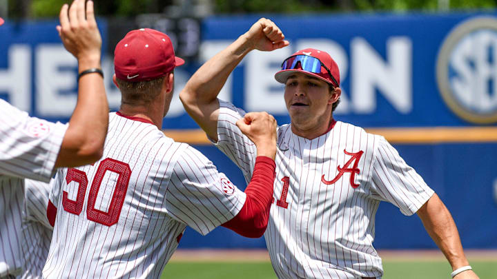 May 21 2024; Hoover, AL, USA; Alabama outfielder William Hamiter (11) celebrates with teammates after making a diving catch in right-center against South Carolina at the Hoover Met on the opening day of the SEC Tournament.