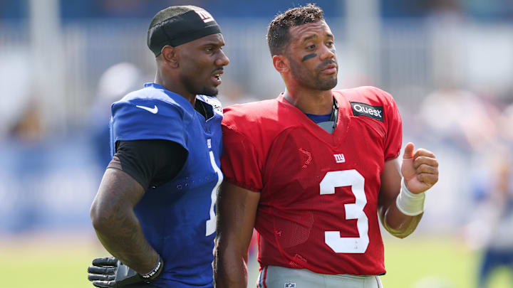 Aug 4, 2025; East Rutherford, NJ, USA; New York Giants wide receiver Malik Nabers (1) talks with quarterback Russell Wilson (3) during training camp at Quest Diagnostics Training Center. Mandatory Credit: Vincent Carchietta-Imagn Images