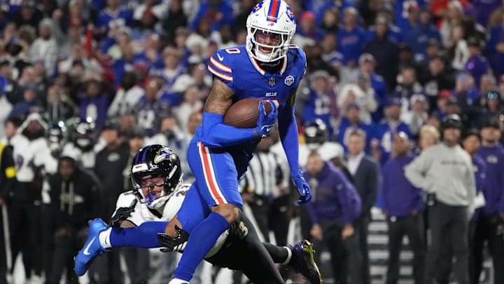 Sep 7, 2025; Orchard Park, New York, USA; Buffalo Bills wide receiver Keon Coleman (0) runs the ball against Baltimore Ravens cornerback Jaire Alexander (23) during the fourth quarter at Highmark Stadium. Mandatory Credit: Gregory Fisher-Imagn Images