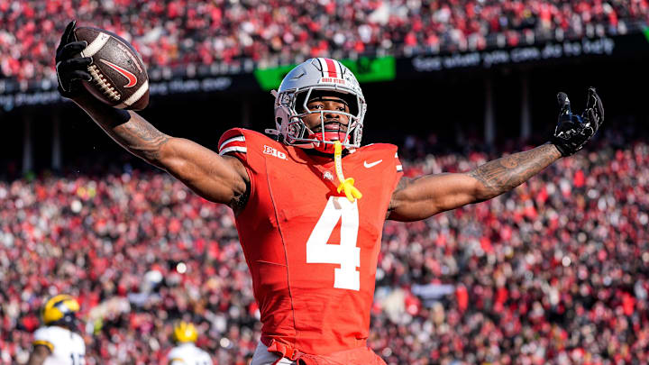 Ohio State wide receiver Jeremiah Smith (4) celebrates a touchdown against Michigan during the first half at Ohio Stadium in Columbus, Ohio on Saturday, Nov. 30, 2024.