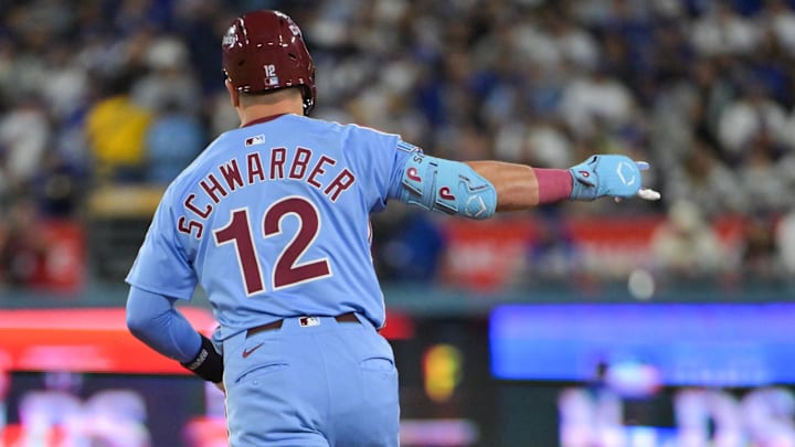 Oct 8, 2025; Los Angeles, California, USA; Philadelphia Phillies designated hitter Kyle Schwarber (12) celebrates after hitting a two run home run during the eighth inning against the Los Angeles Dodgers during game three of the NLDS round for the 2025 MLB playoffs at Dodger Stadium. Mandatory Credit: Jayne Kamin-Oncea-Imagn Images Oct 8, 2025; Los Angeles, California, USA; Philadelphia Phillies designated hitter Kyle Schwarber (12) celebrates after hitting a two run home run during the eighth inning against the Los Angeles Dodgers during game three of the NLDS round for the 2025 MLB playoffs at Dodger Stadium. Mandatory Credit: Jayne Kamin-Oncea-Imagn Images