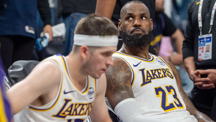 Los Angeles Lakers forward LeBron James (23) reacts to a replay during the first round of the 2025 NBA Playoffs at Target Center. 