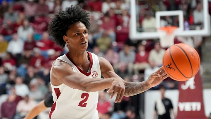 Jan 21, 2025; Tuscaloosa, AL, USA; Alabama guard Aden Holloway (2) makes a pass after penetrating the defense at Coleman Coliseum. Alabama defeated Vanderbilt 103-87. Mandatory Credit: Gary Cosby Jr.-Tuscaloosa News