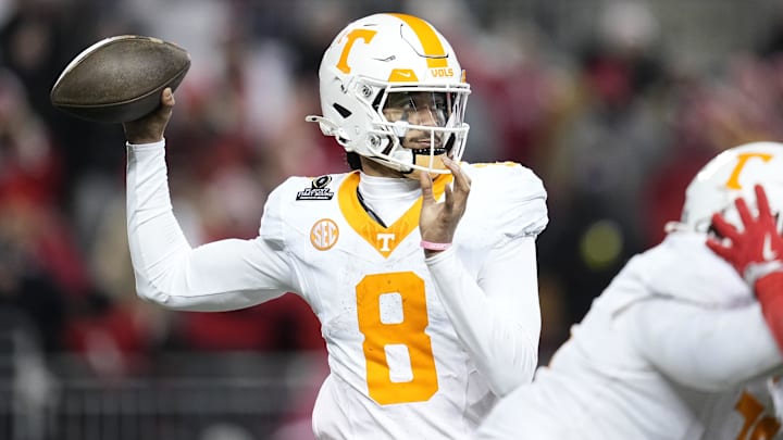 Dec 21, 2024; Columbus, Ohio, USA; Tennessee Volunteers quarterback Nico Iamaleava (8) throws against the Ohio State Buckeyes during the second half of the College Football Playoff first round game at Ohio Stadium. Ohio State won 42-17. Mandatory Credit: Adam Cairns-Imagn Images