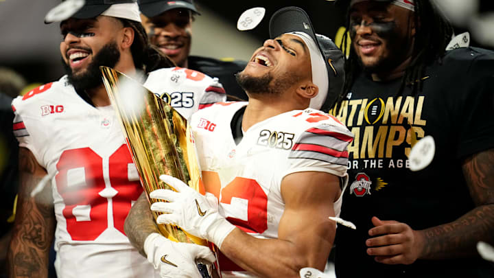 Ohio State Buckeyes running back TreVeyon Henderson (32) celebrates with the trophy following the 34-23 win over the Notre Dame Fighting Irish to win the College Football Playoff National Championship at Mercedes-Benz Stadium in Atlanta on Jan. 22, 2025.