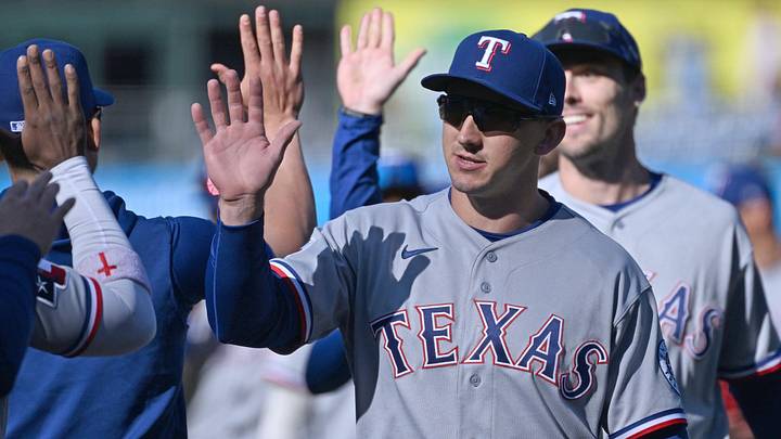 Texas Rangers left fielder Wyatt Langford celebrates win.