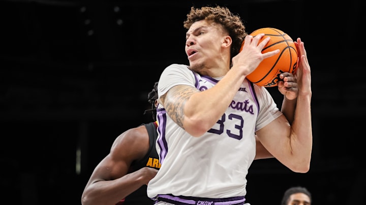 Mar 11, 2025; Kansas City, MO, USA; Kansas State Wildcats guard Coleman Hawkins (33) drives to the basket during the first half against the Arizona State Sun Devils at T-Mobile Center. Mandatory Credit: William Purnell-Imagn Images