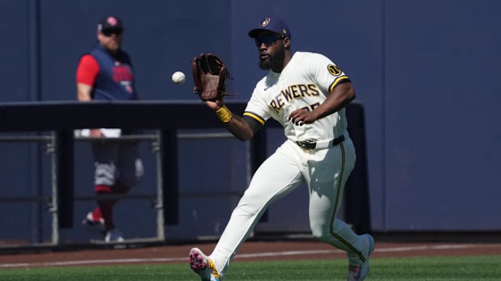 Mar 3, 2026; Phoenix, AZ, USA; Milwaukee Brewers left fielder Akil Baddoo (25) makes the play for an out against Great Britain in the first inning at the American Family Fields. Mandatory Credit: Rick Scuteri-Imagn Images Mar 3, 2026; Phoenix, AZ, USA; Milwaukee Brewers left fielder Akil Baddoo (25) makes the play for an out against Great Britain in the first inning at the American Family Fields. Mandatory Credit: Rick Scuteri-Imagn Images