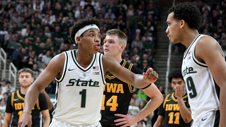 Dec 2, 2025; East Lansing, Michigan, USA;  Michigan State Spartans guard Jeremy Fears Jr. (1) instructs teammate Michigan State Spartans guard Divine Ugochukwu (99) during the first half against the Iowa Hawkeyes at Jack Breslin Student Events Center. Mandatory Credit: Dale Young-Imagn Images