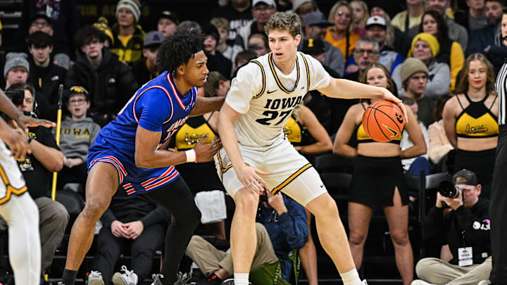 Dec 29, 2025; Iowa City, Iowa, USA; Iowa Hawkeyes center Trevin Jirak (27) controls the ball as UMass Lowell River Hawks forward Austin Green (10) defends during the first half at Carver-Hawkeye Arena. Mandatory Credit: Jeffrey Becker-Imagn Images Dec 29, 2025; Iowa City, Iowa, USA; Iowa Hawkeyes center Trevin Jirak (27) controls the ball as UMass Lowell River Hawks forward Austin Green (10) defends during the first half at Carver-Hawkeye Arena. Mandatory Credit: Jeffrey Becker-Imagn Images