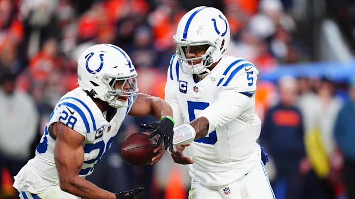 Dec 15, 2024; Denver, Colorado, USA; Indianapolis Colts quarterback Anthony Richardson (5) hands off to running back Jonathan Taylor (28) in the second half against the Denver Broncos at Empower Field at Mile High. Dec 15, 2024; Denver, Colorado, USA; Indianapolis Colts quarterback Anthony Richardson (5) hands off to running back Jonathan Taylor (28) in the second half against the Denver Broncos at Empower Field at Mile High.