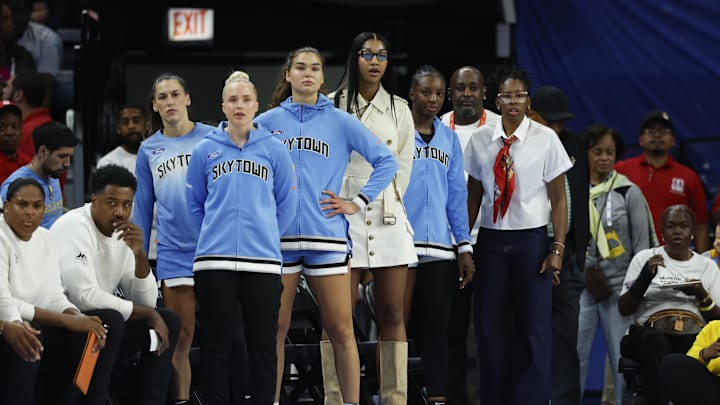 Aug 1, 2025; Chicago, Illinois, USA; Injured Chicago Sky forward Angel Reese (C) looks on from the bench during the first half of a WNBA game against the Golden State Valkyries at Wintrust Arena. Mandatory Credit: Kamil Krzaczynski-Imagn Images