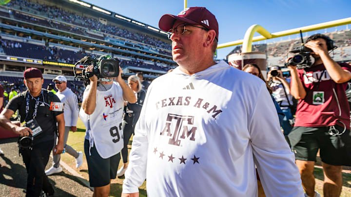 Nov 22, 2025; College Station, Texas, USA; Texas A&M Aggies head coach Mike Elko walks off the field after defeating the Samford Bulldogs 48-0 in a game at Kyle Field. Mandatory Credit: Joseph Buvid-Imagn Images