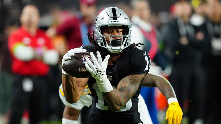 Dec 14, 2023; Paradise, Nevada, USA;  Las Vegas Raiders wide receiver Jakobi Meyers (16) makes a catch for a touchdown against the Los Angeles Chargers in the first quarter at Allegiant Stadium. Mandatory Credit: Stephen R. Sylvanie-Imagn Images