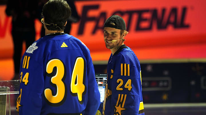 Feb 1, 2024; Toronto, Ontario, CANADA; Team Matthews celebrity coach Justin Bieber (24) talks to Team Matthews captain Auston Matthews during the NHL All-Star Player Draft on NHL All-Star Thursday at Scotiabank Arena. Mandatory Credit: John E. Sokolowski-Imagn Images